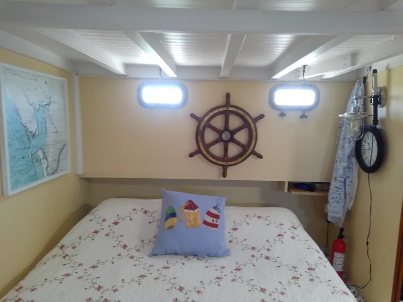 Slide: The Image of Cozy cabin interior of 1975 Marine Trader 40 Double Cabin with nautical decor. - 41