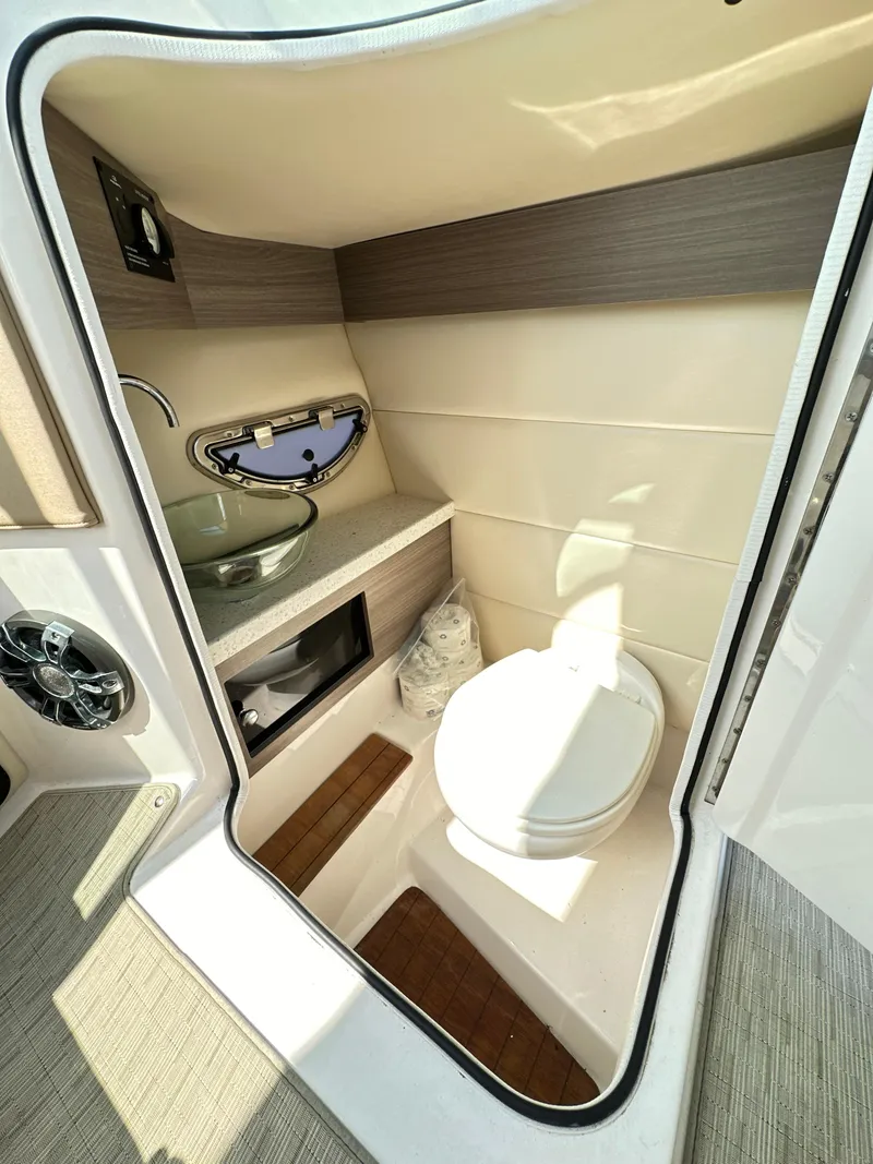 Slide: The Image of 2019 Regal 29 OBX boat bathroom with sink, toilet, and modern design. - 33