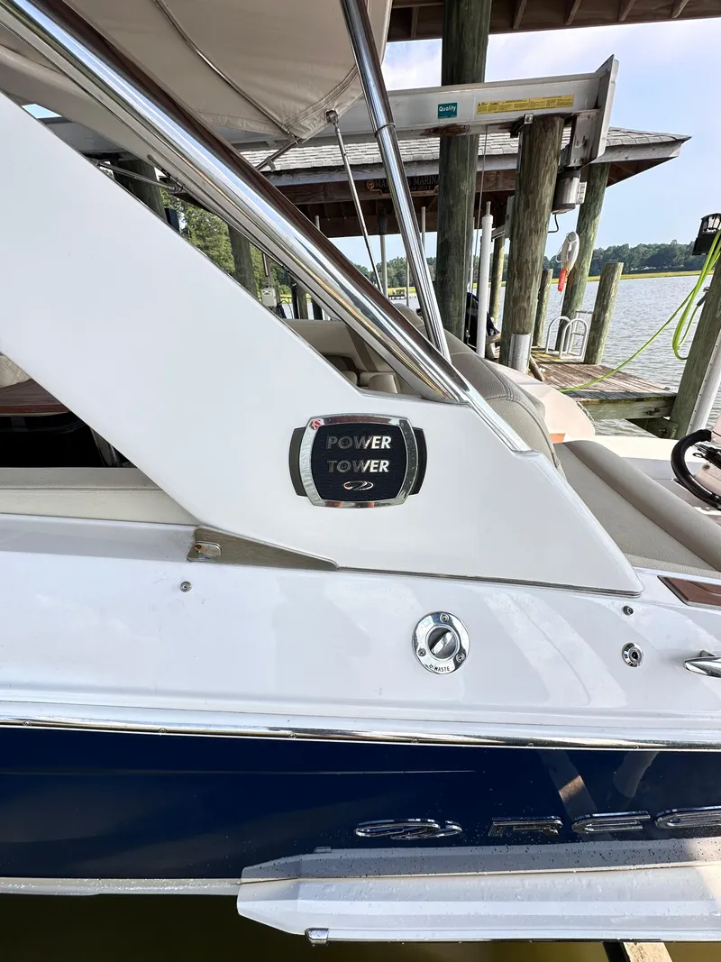 Slide: The Image of 2019 Regal 29 OBX boat docked, featuring sleek design and modern controls. - 43