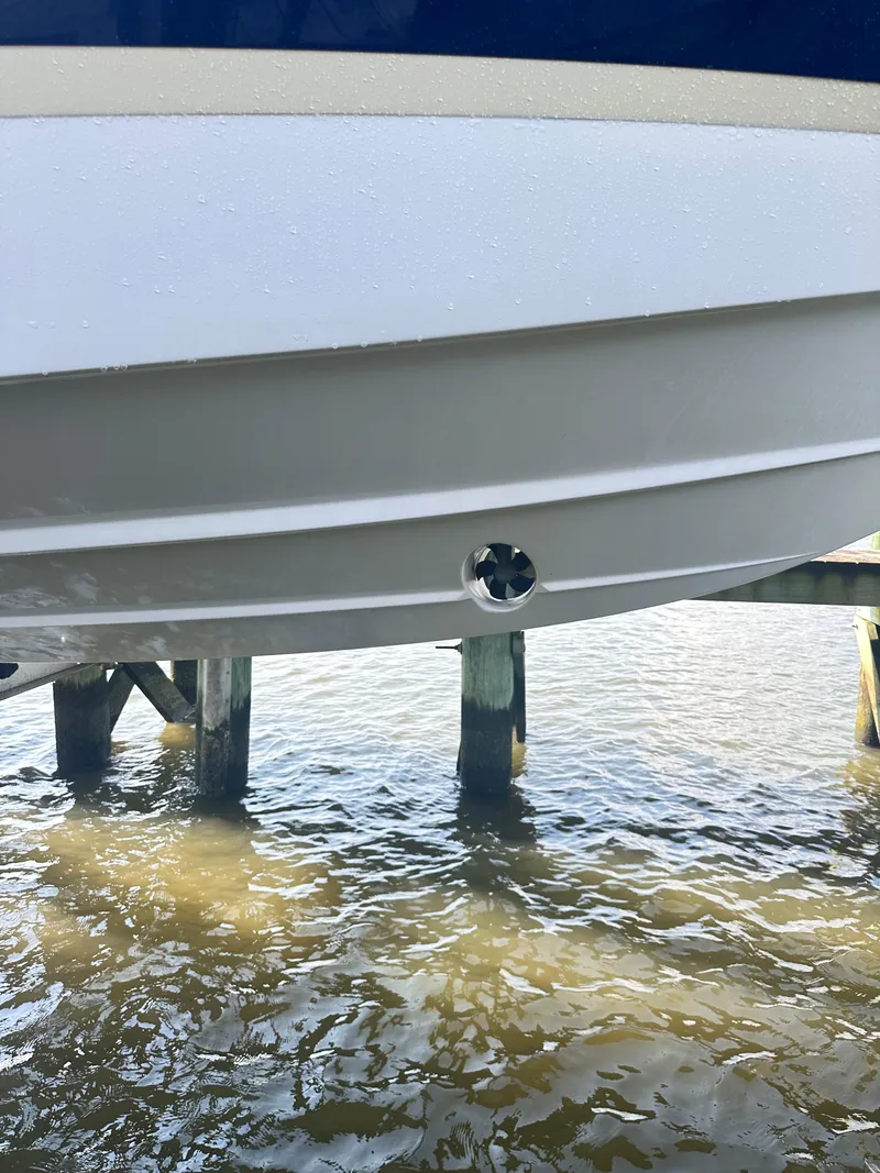 Slide: The Image of 2019 Regal 29 OBX boat hull above water at dock. - 46