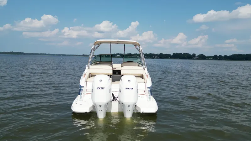 Slide: The Image of 2019 Regal 29 OBX boat with twin engines on a calm lake. - 6