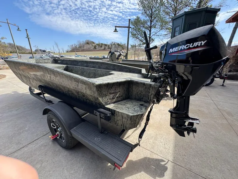 Slide: The Image of 2025 Tracker Grizzly 1650 T Prairie Wings Edition boat with Mercury engine on trailer. - 3