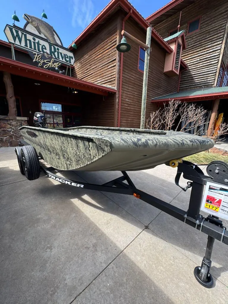 Slide: The Image of 2025 Tracker Grizzly 1650 T Prairie Wings Edition boat outside White River Fly Shop. - 6
