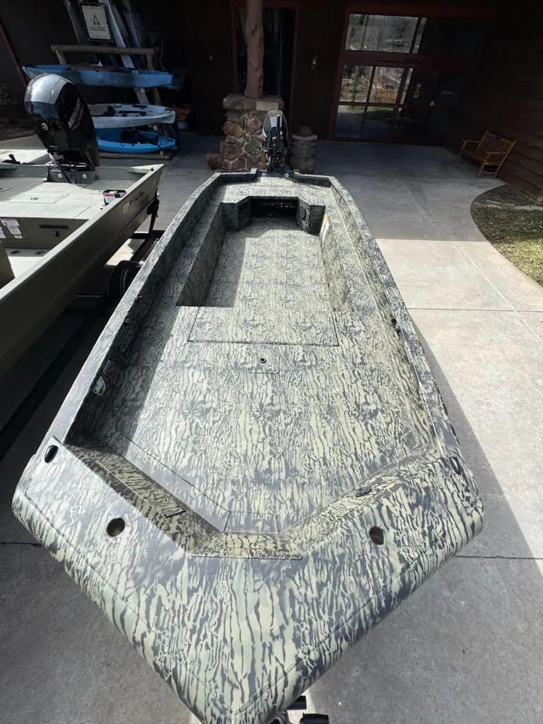 Slide: The Image of 2025 Tracker Grizzly 1650 T Prairie Wings Edition boat with camouflage design. - 7