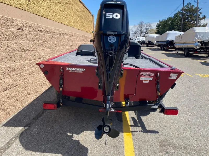 Slide: The Image of 2025 Tracker Bass Tracker Classic XL boat with Mercury 50 engine, parked outdoors. - 3