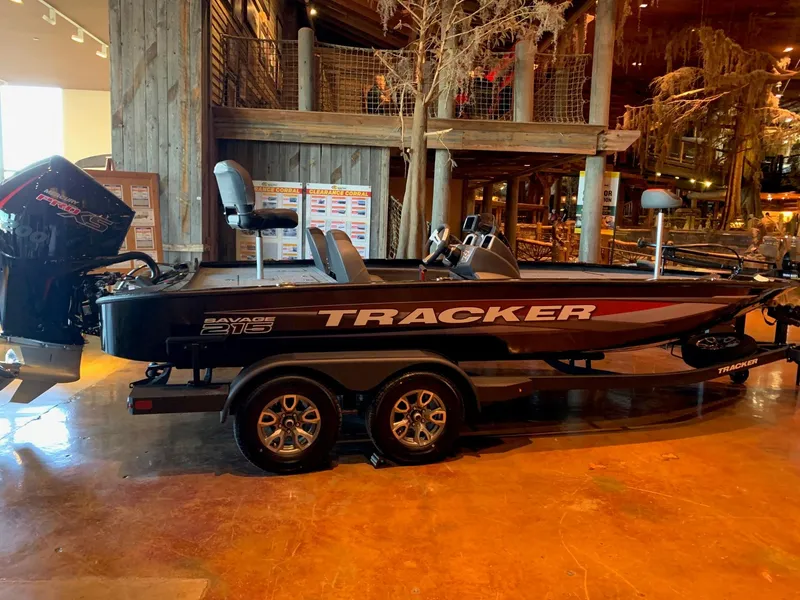 The Image of 2025 Tracker Savage 215 boat displayed indoors on a trailer. - 0