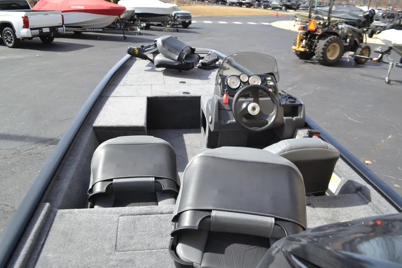 Slide: The Image of 2025 Tracker Pro 170 boat interior with steering console and seating. - 4