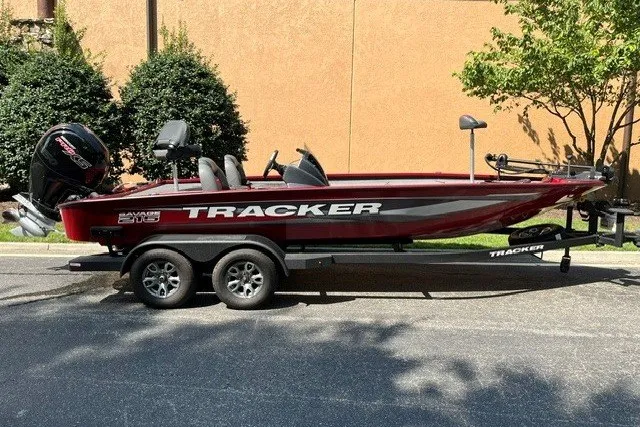 The Image of 2025 Tracker Savage 215 boat on trailer, parked outdoors, side view. - 0