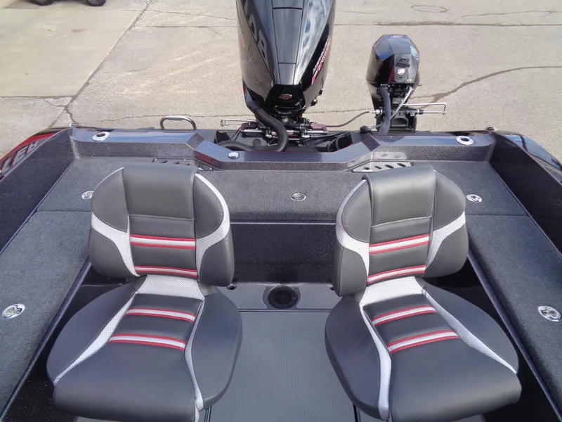Slide: The Image of 2024 Ranger 620FS boat interior with dual seats and motor, showcasing modern design. - 10