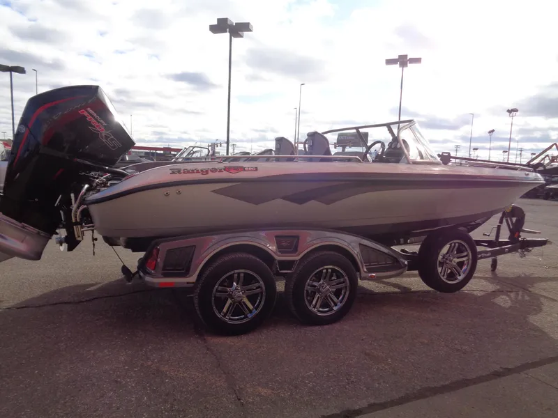 Slide: The Image of 2024 Ranger 620FS Ranger Cup Equipped boat on trailer, parked outdoors. - 3