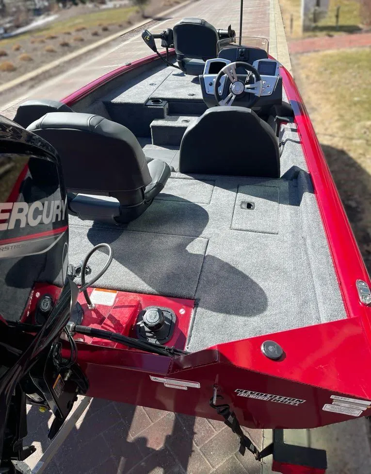 Slide: The Image of 2025 Tracker Pro Team 175 boat with red exterior and Mercury engine. - 6