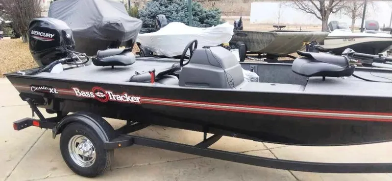 Slide: The Image of 2025 Tracker Bass Tracker Classic XL boat with Mercury engine on trailer. - 3