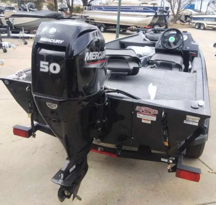 Slide: The Image of 2025 Tracker Bass Tracker Classic XL with Mercury 50 outboard motor, parked on trailer. - 4