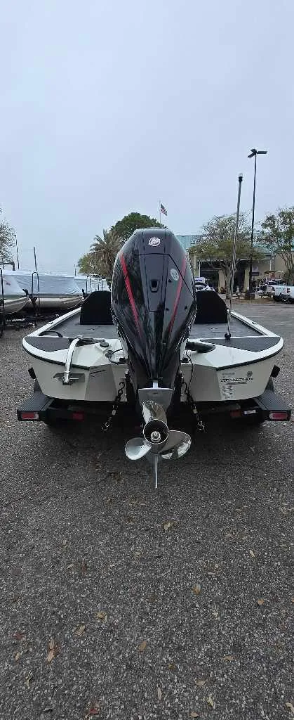 Slide: The Image of Interior of 2025 Tracker Savage 215 boat with steering wheel and navigation system. - 2