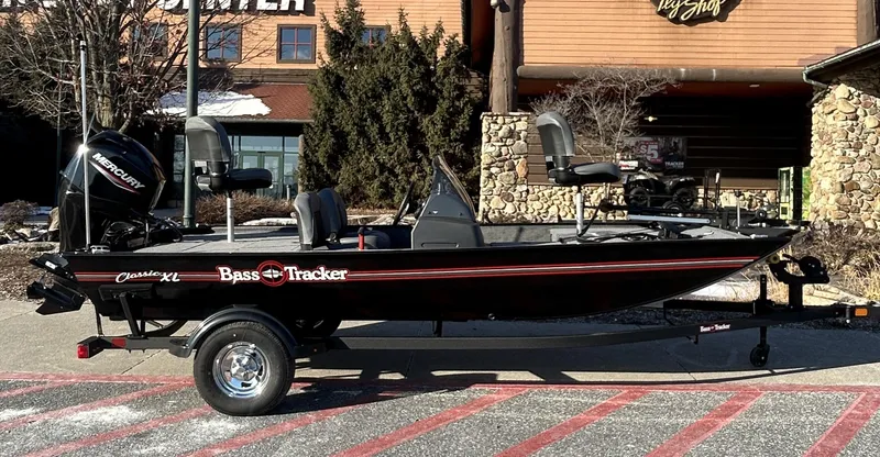 Slide: The Image of 2025 Tracker Bass Tracker Classic XL boat parked outdoors. - 3