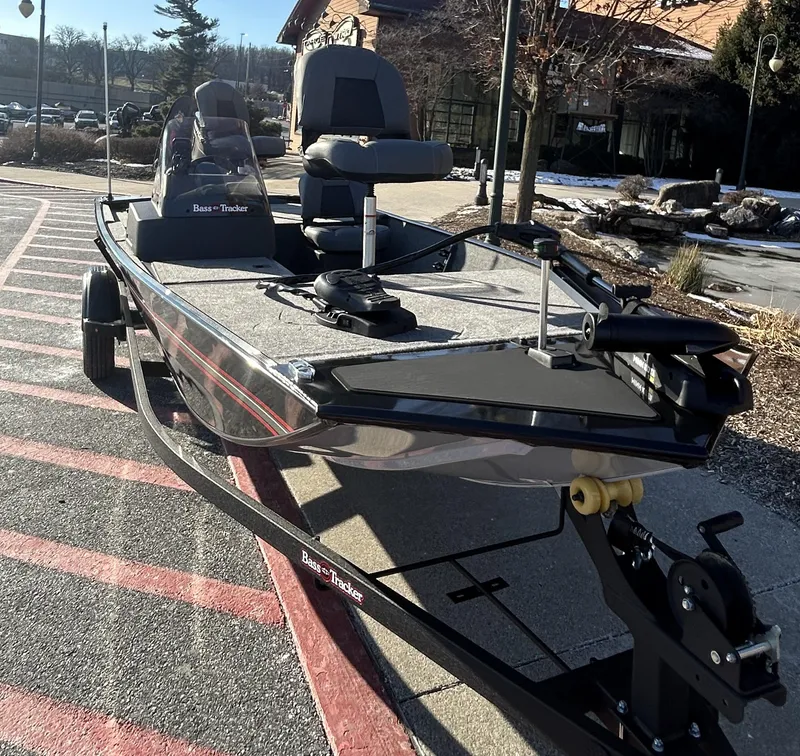 Slide: The Image of 2025 Tracker Bass Tracker Classic XL boat parked outdoors on a sunny day. - 4