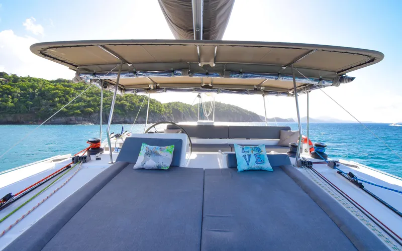 Slide: The Image of Luxurious 2015 Lagoon 450F catamaran with spacious deck and scenic ocean view. - 14