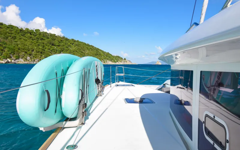 Slide: The Image of Lagoon 450F catamaran sailing in clear blue waters, 2015 model. - 19