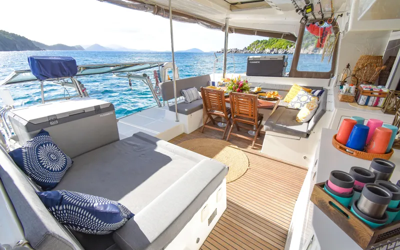 Slide: The Image of Luxurious 2015 Lagoon 450F yacht interior with cozy seating and ocean view. - 22