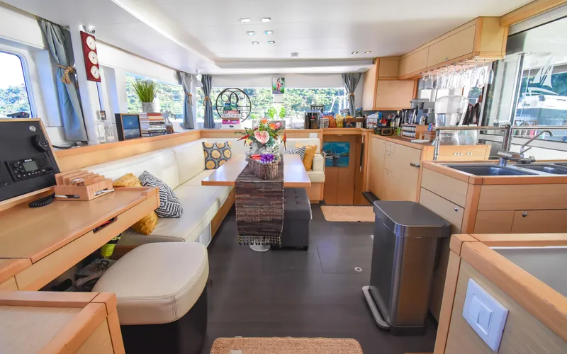 Slide: The Image of Spacious interior of 2015 Lagoon 450F catamaran with modern kitchen and dining area. - 29