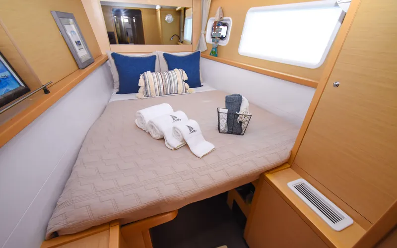 Slide: The Image of Luxurious cabin interior of 2015 Lagoon 450F yacht with cozy bedding and elegant decor. - 37