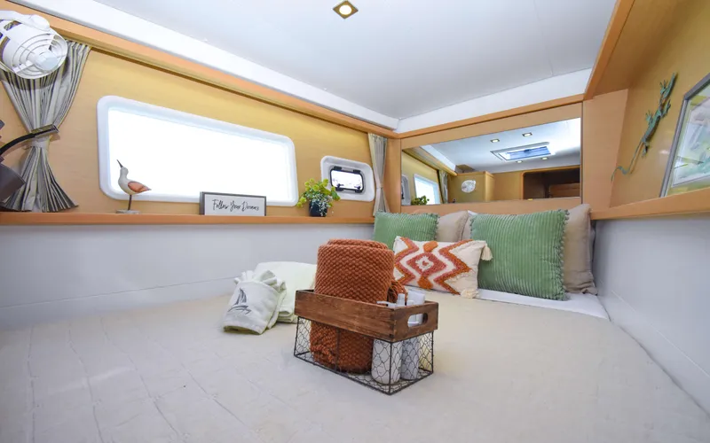 Slide: The Image of Cozy interior of 2015 Lagoon 450F yacht with stylish decor and comfortable bedding. - 39