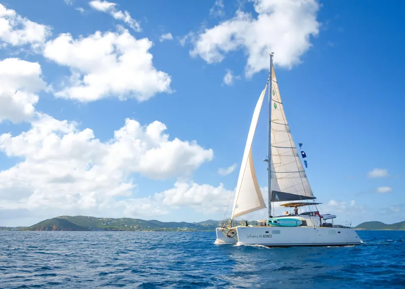 Slide: The Image of Lagoon 450F catamaran sailing on blue ocean under clear sky, 2015 model. - 4
