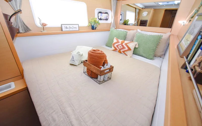 Slide: The Image of Cozy bedroom interior of 2015 Lagoon 450F yacht with stylish decor and comfortable bedding. - 40