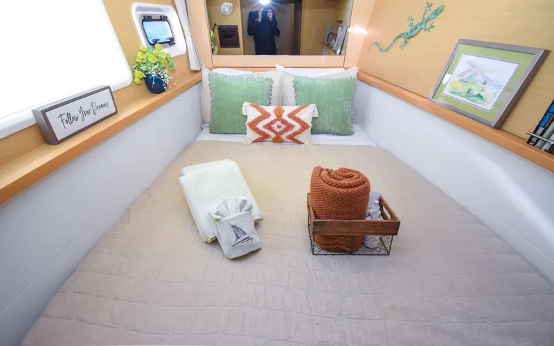 Slide: The Image of Cozy bedroom interior of 2015 Lagoon 450F yacht with decorative pillows and blankets. - 41
