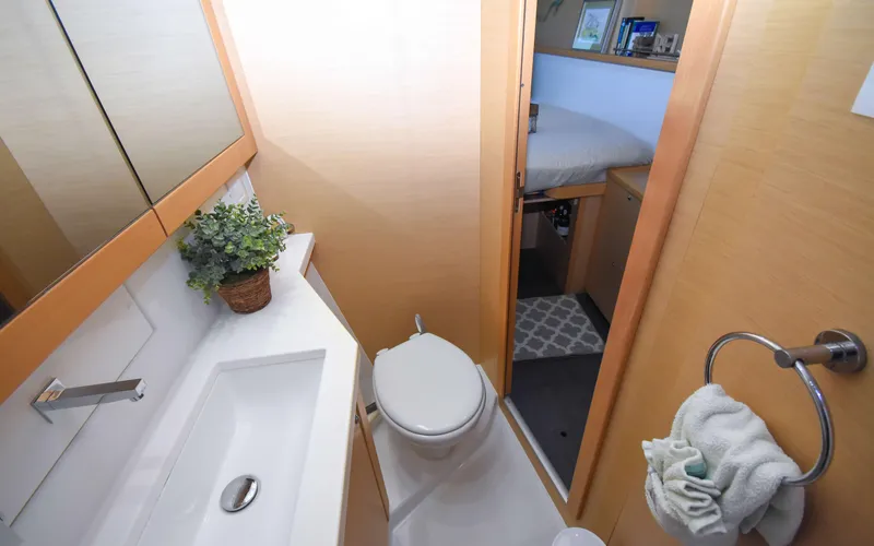 Slide: The Image of Bathroom interior of 2015 Lagoon 450F yacht, featuring modern fixtures and cozy design. - 44
