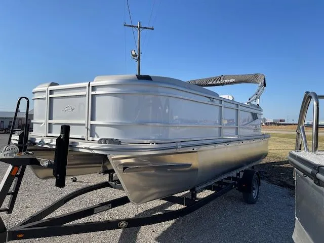 Slide: The Image of 2025 SunCatcher Select 20RC pontoon boat on trailer, parked outdoors. - 1