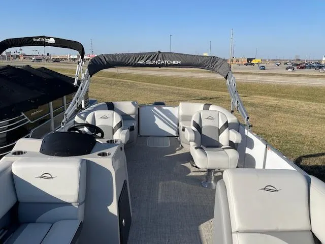 Slide: The Image of 2025 SunCatcher Select 20RC pontoon boat with spacious seating and modern design. - 10