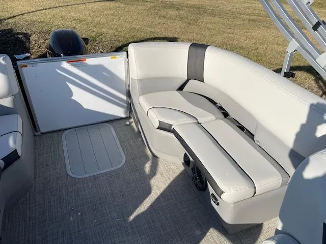 Slide: The Image of 2025 SunCatcher Select 20RC boat interior with plush seating and modern design. - 19