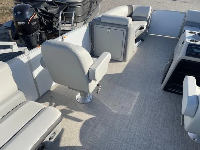 Slide: The Image of 2025 SunCatcher Select 20RC pontoon boat interior with gray seating and modern design. - 22