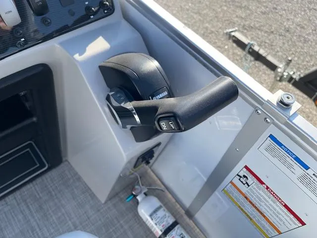 Slide: The Image of Throttle control of 2025 SunCatcher Select 20RC boat, featuring safety instructions and fire extinguisher. - 23
