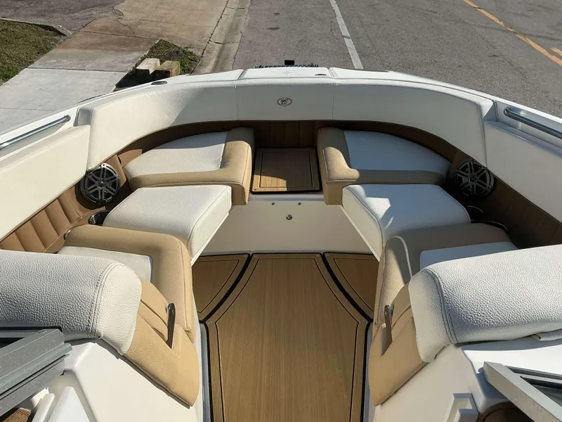 Slide: The Image of Interior of 2022 Cobalt 23 SC boat with beige and white seating. - 13