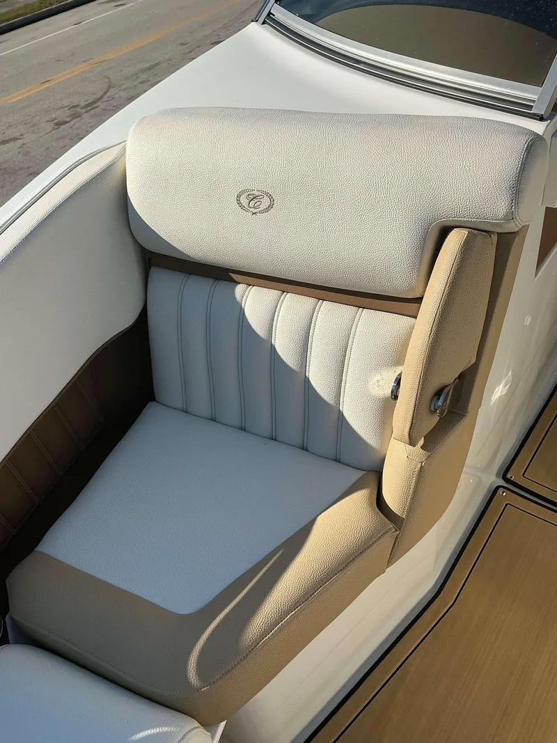 Slide: The Image of 2022 Cobalt 23 SC boat seat with beige and white upholstery. - 14