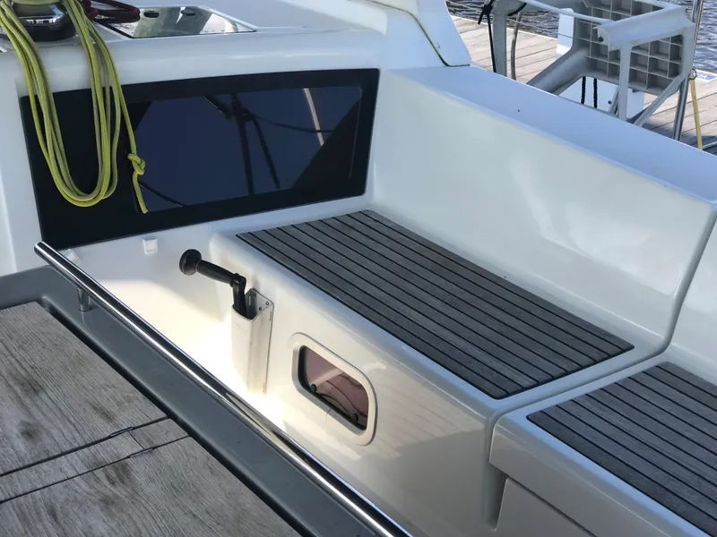 Slide: The Image of 2014 Beneteau Oceanis 48 yacht cockpit with teak seating and modern design. - 10