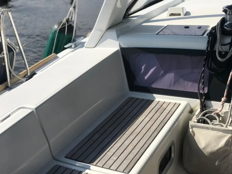 Slide: The Image of Beneteau Oceanis 48 cockpit area, 2014 model, featuring seating and nautical equipment. - 12