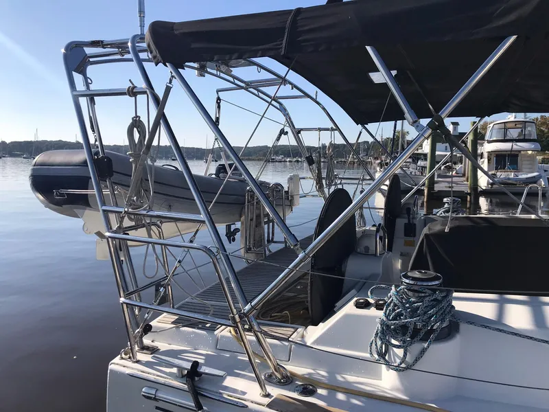 The Image of 2014 Beneteau Oceanis 48 sailboat docked, featuring sleek design and modern rigging. - 2