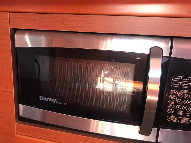 Slide: The Image of Built-in Danby Designer microwave in 2014 Beneteau Oceanis 48 yacht kitchen. - 34