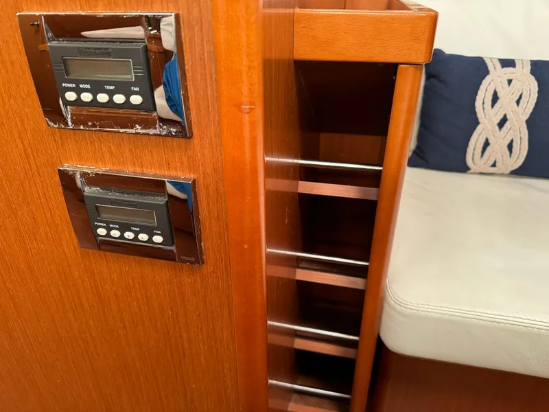 Slide: The Image of Interior of 2014 Beneteau Oceanis 48 yacht with control panels and seating. - 36