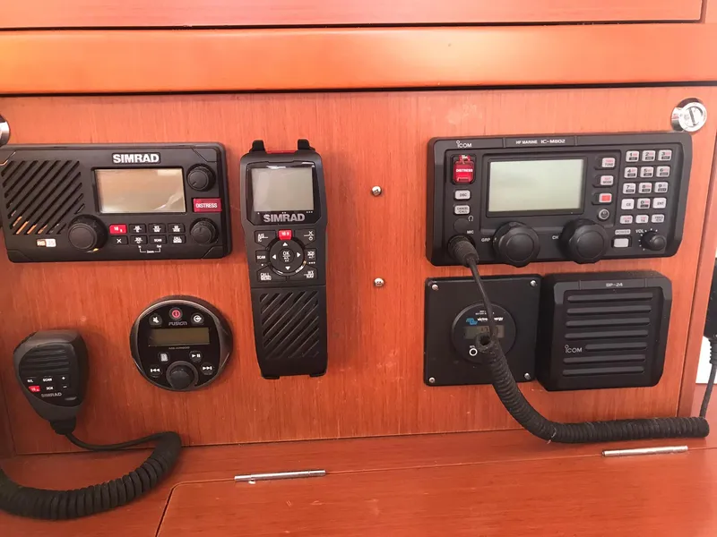 Slide: The Image of Control panel of a 2014 Beneteau Oceanis 48 with Simrad and Icom marine electronics. - 38