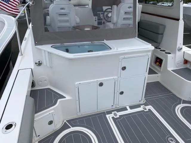 Slide: The Image of 2025 NorthCoast 285 HT boat interior with seating, storage, and modern design. - 4