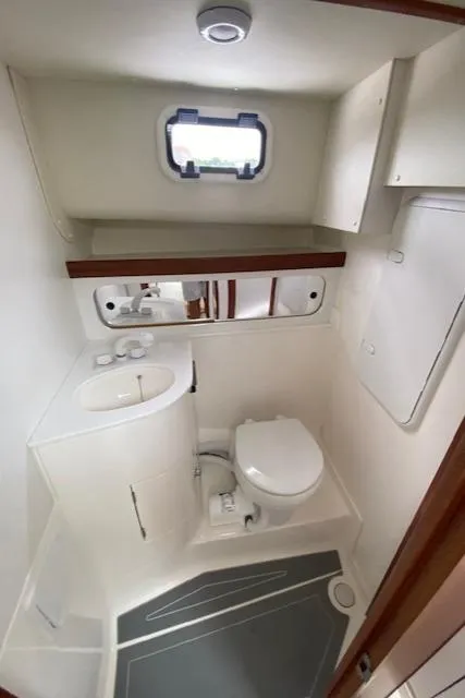 Slide: The Image of Modern bathroom in 2025 NorthCoast 285 HT boat with compact design and amenities. - 6