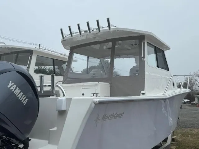 Slide: The Image of 2025 NorthCoast 285 HT boat with Yamaha engine, docked outdoors. - 8