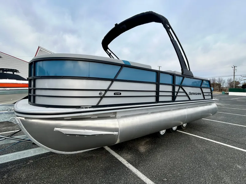 Slide: The Image of 2025 Berkshire 22CL2 ARCH CTS pontoon boat in a parking lot. - 2