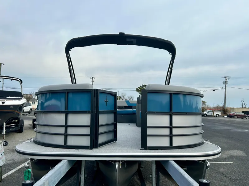 Slide: The Image of 2025 Berkshire 22CL2 ARCH CTS 2.75 pontoon boat, docked, with sleek design and modern features. - 3