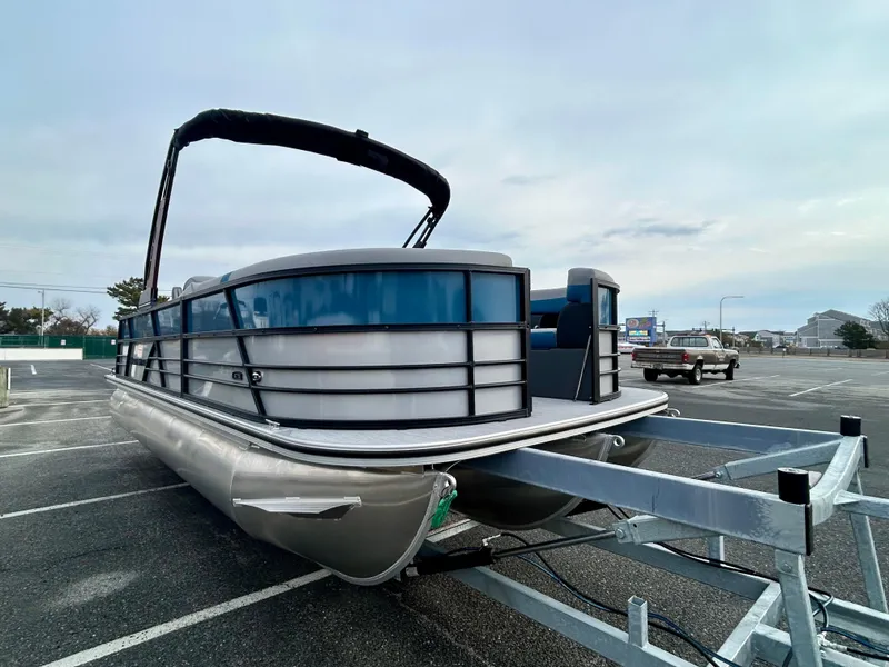 Slide: The Image of 2025 Berkshire 22CL2 ARCH CTS 2.75 pontoon boat on trailer in parking lot. - 4