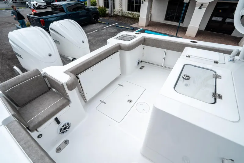 Slide: The Image of 2025 Sea Hunt Gamefish 28 CB boat interior with seating and storage compartments. - 12